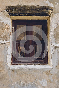 Old vintage traditional wooden window and cement wall