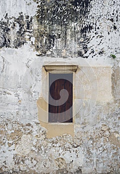 Old vintage traditional wooden window and cement wall