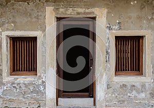 Old vintage traditional wooden window, door and cement wall