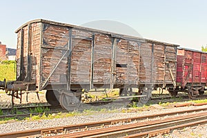 An old vintage train wagon on the rails