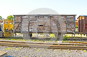 An old vintage train wagon on the rails