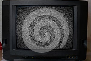 the old vintage tv with noise texture at home