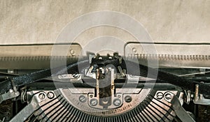 Old vintage typewriter with blank paper. close-up