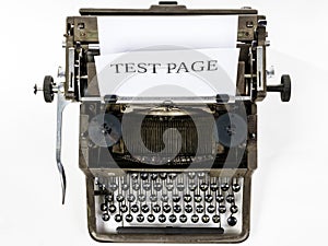 Old vintage typewriter with blank paper sheet