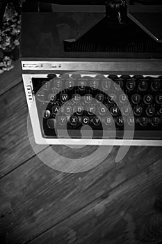 Old vintage typewriter on a desk, cinematic noir scene