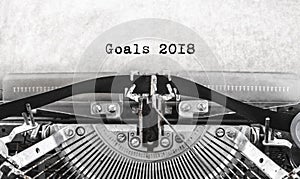 Old vintage typewriter happy new year written goals 2018