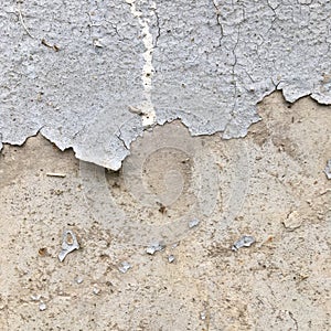 Old vintage wall with peeling gray paint. Abstract textural background.