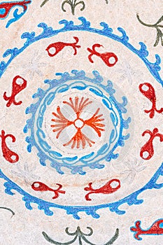 Old vintage white rug with traditional Arabic Uzbek pattern in Uzbekistan close-up