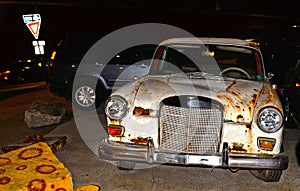 Old vintage white rusty car Mercedes-Benz W110 190 on the street in New York City near Brooklyn promenade 22.05.2016. New York USA