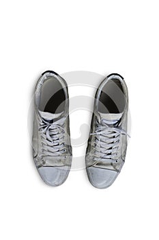 Old vintage white sneakers isolated on white background with clipping path