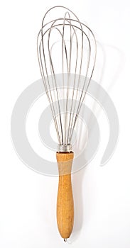 Old vintage wire whisk isolated over white