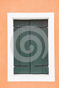 Old vintage wood door with old green wallpaper