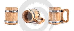 Old vintage wooden beer mugs from different angles on a light isolated background with metal mounts