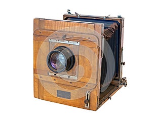 Old vintage wooden camera with lens