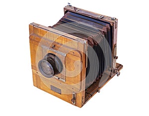 Old vintage wooden camera with lens