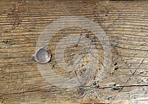 Old vintagewood wooden surface backgroundwith steel metal bolt screw