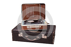 Old vinyl player on an old suitcase