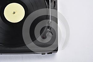 Old vinyl record player on white background