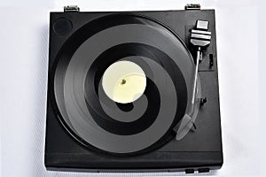 Old vinyl record player on white background