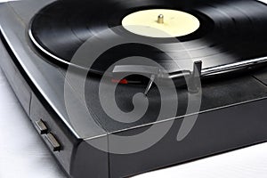 Old vinyl record player on white background