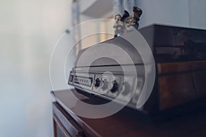 An old vinyl record player with wooden cases