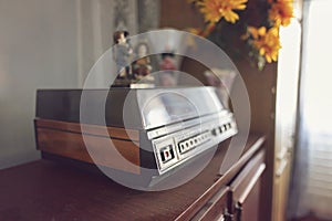 An old vinyl record player with wooden cases