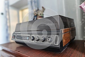 An old vinyl record player with wooden cases