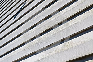 Old vinyl siding texture on house exterior