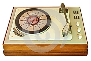 Old vinyl turntable player from the seventies isolated on white