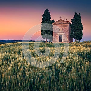 Old Vitaleta chapel and grain fields at sunset, Tuscany, Italy