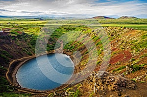 Old volcanic crater with a lake in beautiful Icelandic landscape. Kerid crater in Iceland