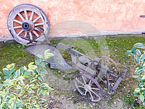 Old wagon wheel and farm implement