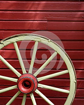 Old Wagon Wheel with Red Wall