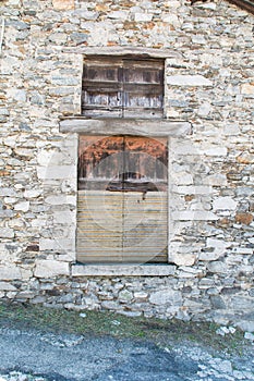 Old wall with blocked windo panes