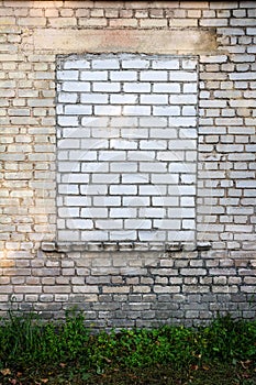 Old wall with bricked up window