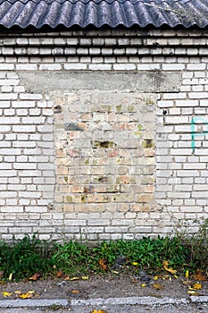 Old wall with bricked up windows