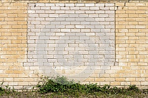 Old wall with bricked up windows