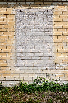 Old wall with bricked up windows