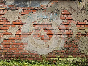 Old Wall with Broken Plaster and Bricks