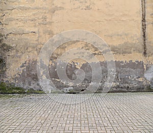 Old wall and cobblestone floor.