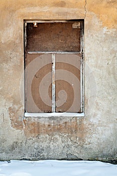 Old wall with covered window