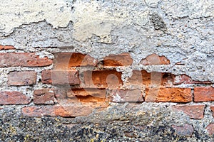 Old wall with crumbled plaster