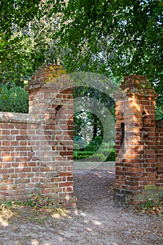 Old wall with entrance to the park