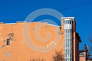 Old wall of the house with external arrangement of the elevator