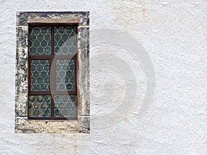 Old wall with leaded glass window