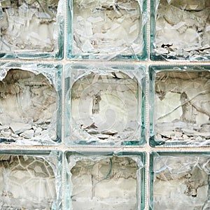 Old wall made of broken glass bricks