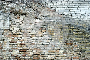 The old wall, mixed various bricks. Fragment of the historical building