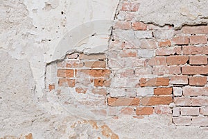 Old wall with plaster and bricks texture