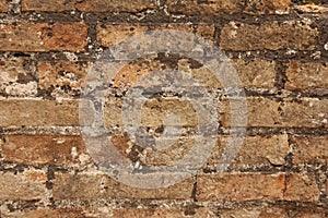 Old Wall of Red Bricks and White Brayed and Cracked Old Paint. Red, Terracotta and White Brick Background. Old Wall for Background