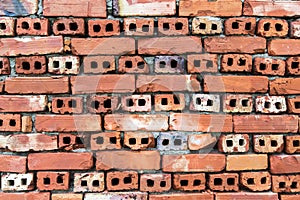 Old wall of red briks tiled background, regular block texture